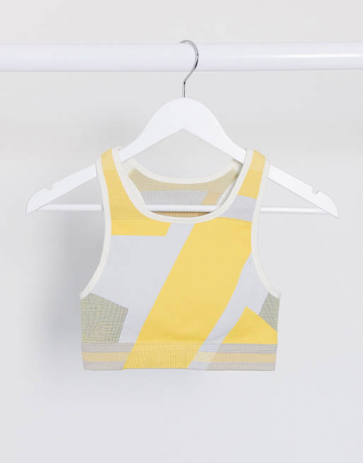 Nike Training - Icon Clash - Naadloze beha met print in geel