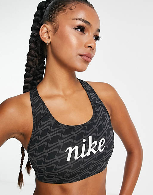 Nike Training Icon Clash Swoosh AOP graphic medium support sports bra in  black | ASOS