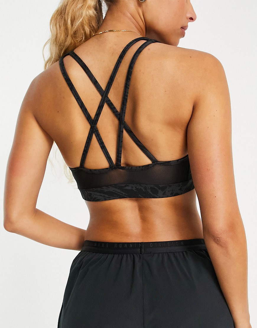 Nike Training Icon Clash Swoosh Dri-FIT strappy printed mid support sports bra in black