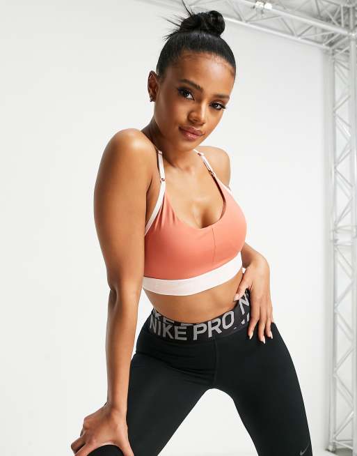 Nike Training Indy Dri-FIT logo band light support sports bra in rose pink