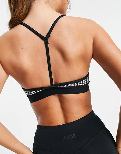  Nike Training Indy light support gingham sports bra in black 