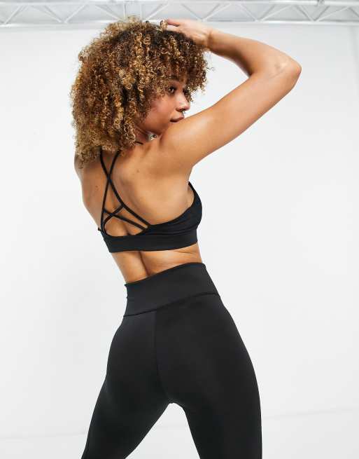 Nike Training Indy light support rainbow ladder sports bra in black