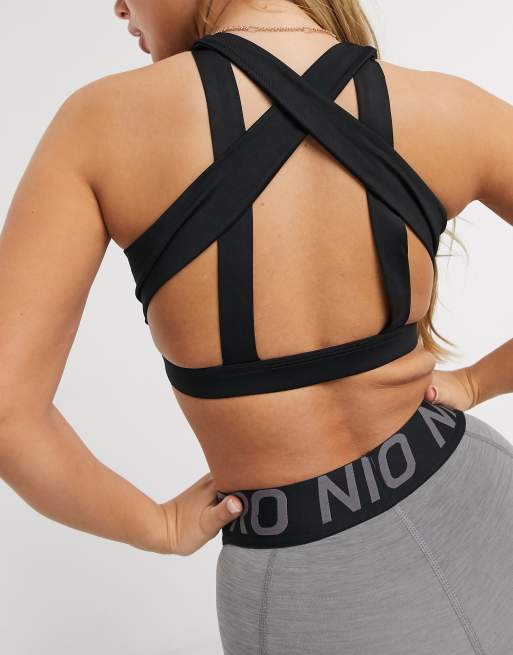 Nike Training Nike Yoga Indy light support cross strap sports bra in black  - ShopStyle