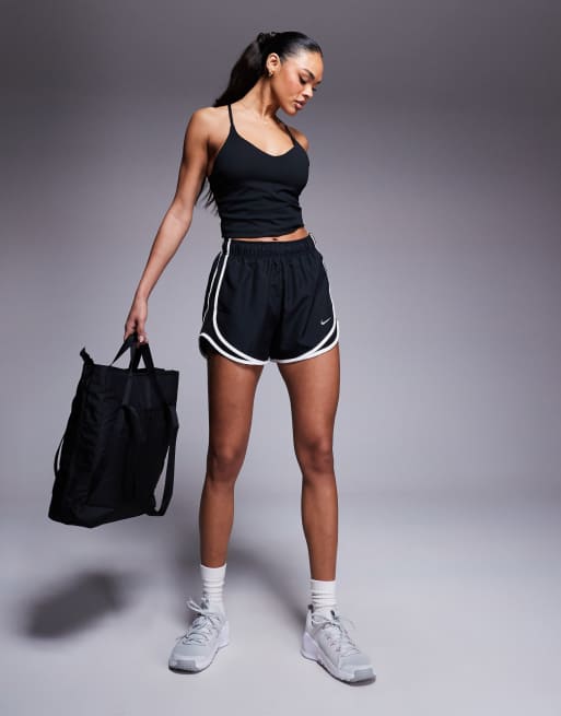 Nike Training Indy light support sports bra tank top in black | ASOS