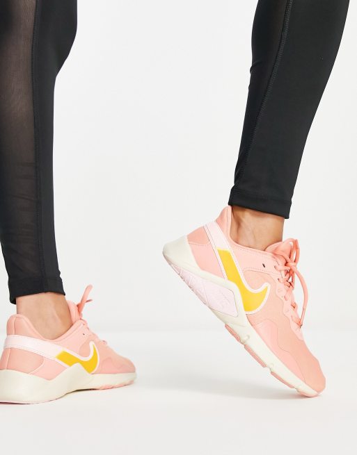 Pink and gold sales nikes