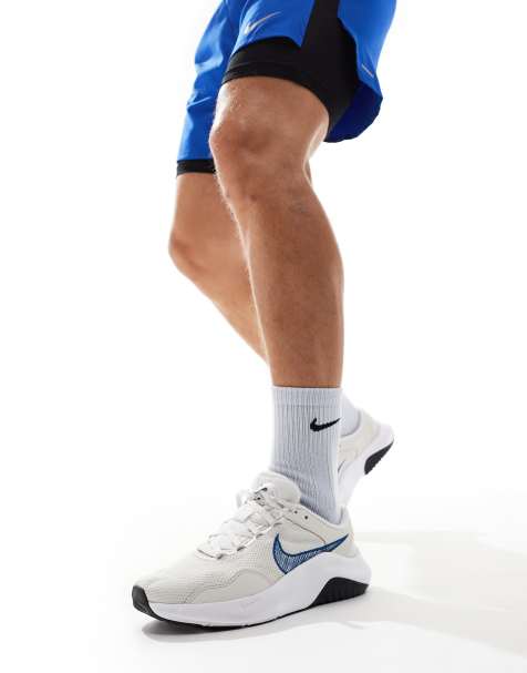Nike Training Legend Essential 3 trainers in white and blue - view 1