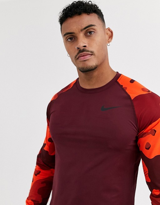 Nike Training long sleeve baselayer top with camo sleeves in burgundy
