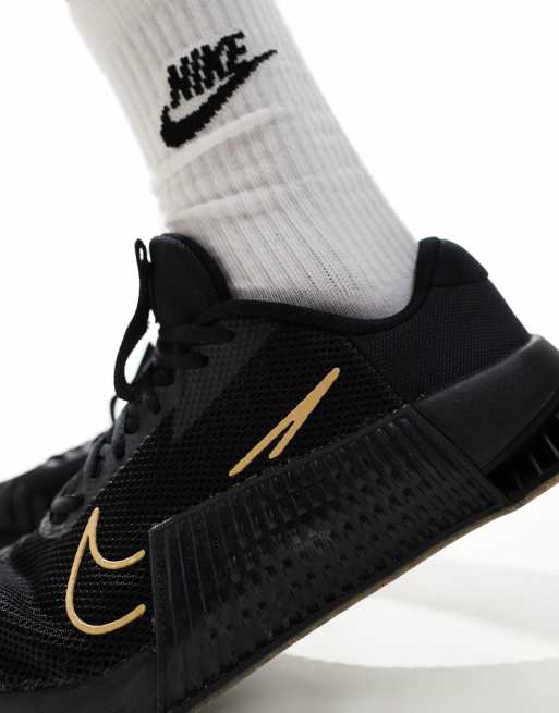 Nike Training Metcon 9 sneakers in black and gold ASOS