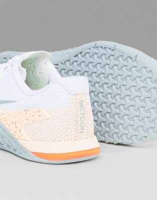nike training metcon trainers in white and orange