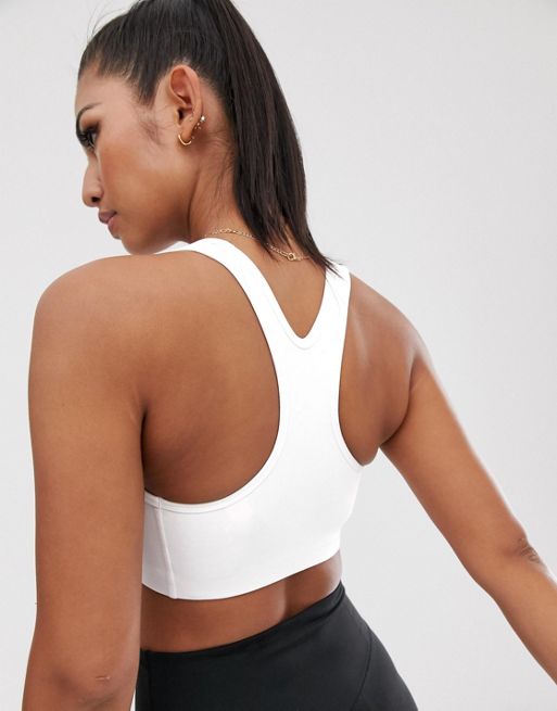 Nike Pro Training swoosh bra in white, ASOS