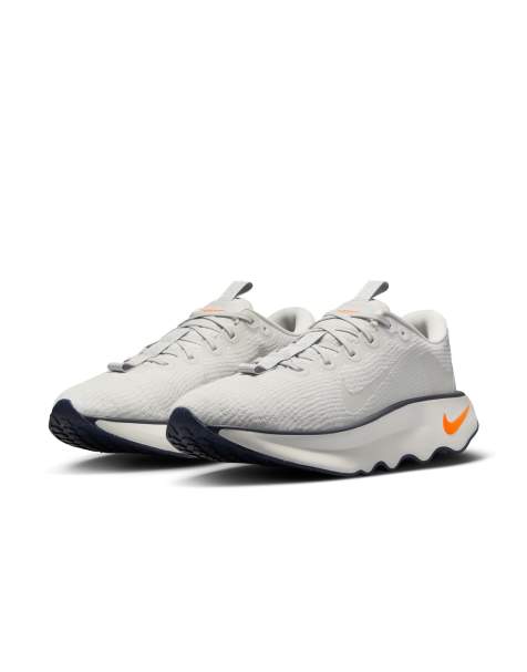 Nike Training Motiva sneakers in white and orange - view 1