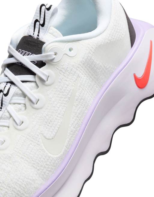 Nike Training Motiva sneakers in white and pink ASOS