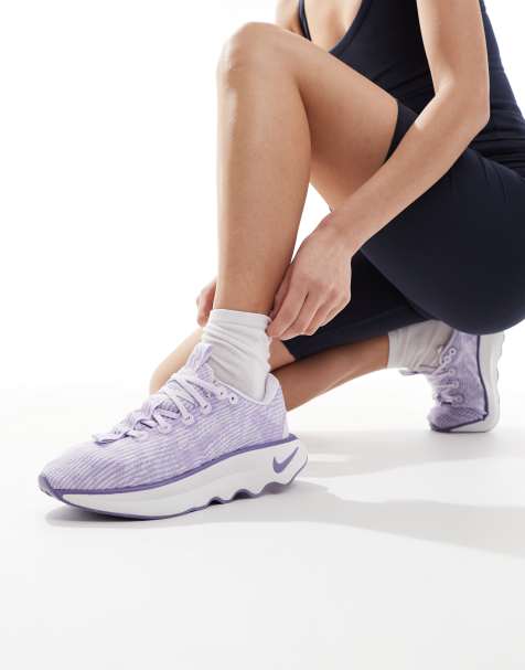 Nike Training Motiva trainers in lilac and white - view 1