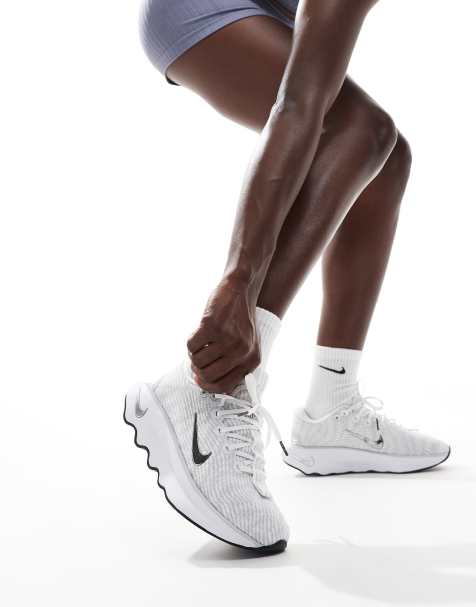 Nike Training Motiva trainers in white and silver - view 1