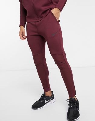 Nike Training NPC joggers in burgundy 