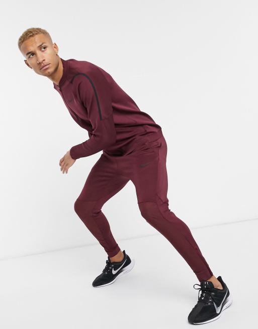 Nike Training NPC joggers in burgundy ASOS