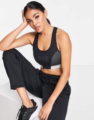 Nike Training One colourblock logo mid support sports bra in black - ASOS Price Checker