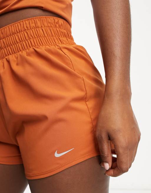 Orange nike running on sale shorts