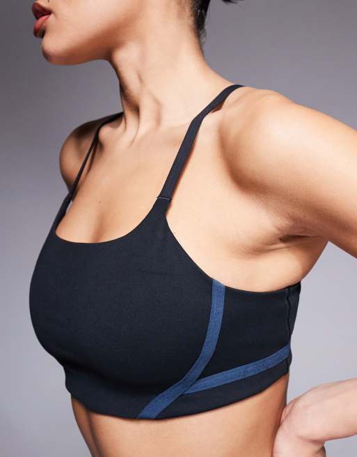 Nike Training One light support contrast stitch sports bra in black, 3 of 4