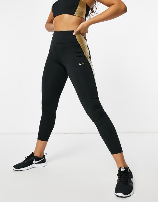 Black nike leggings store with gold logo