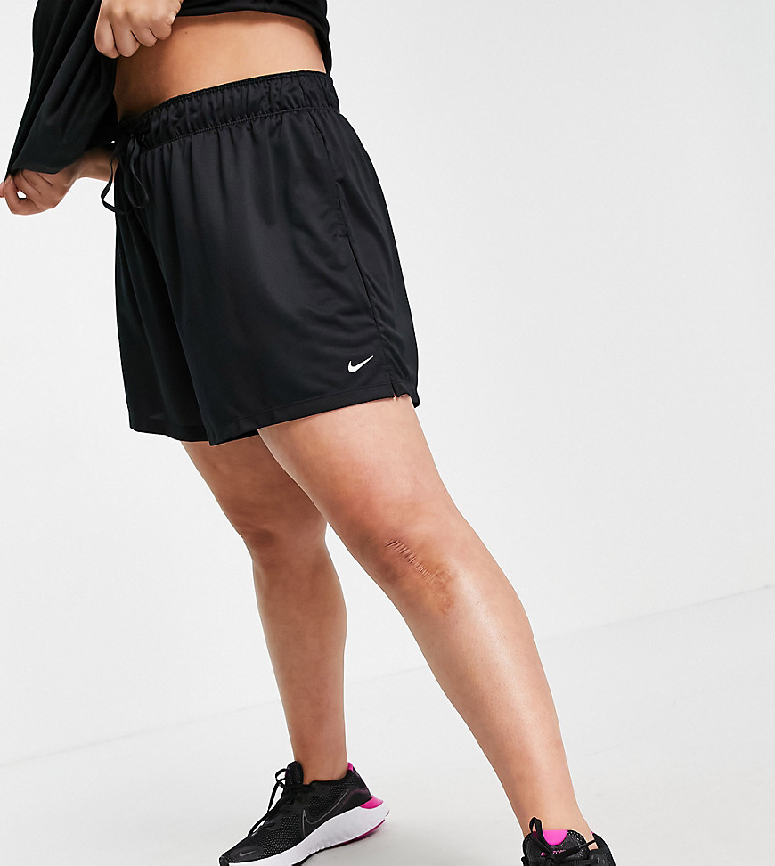 Plus-size shorts by Nike Training Elasticated drawstring waist Side pockets Nike logo print Regular fit True to size