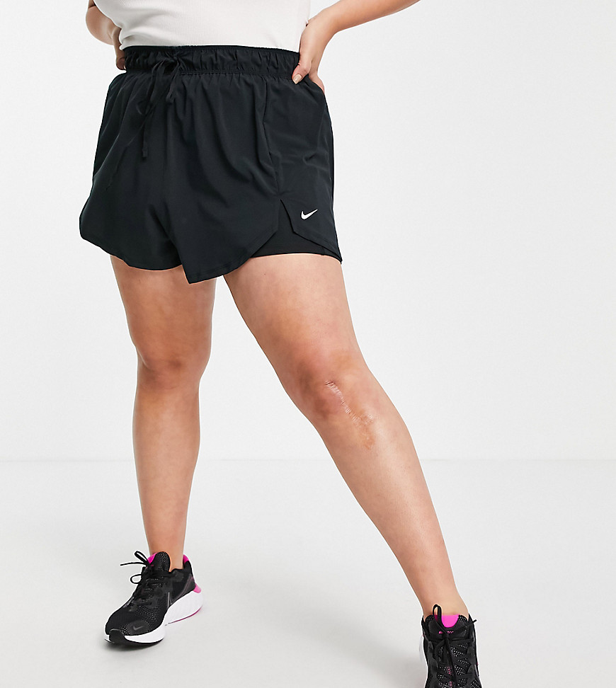 Plus-size shorts by Nike Rep and repeat 2-in-1 design Elasticated drawstring waist Nike logo print Split sides Regular fit True to size