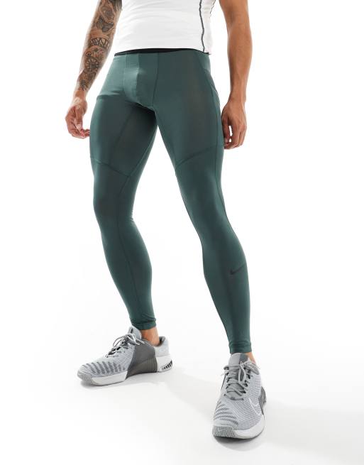 Nike Training Pro compression leggings in dark green ASOS