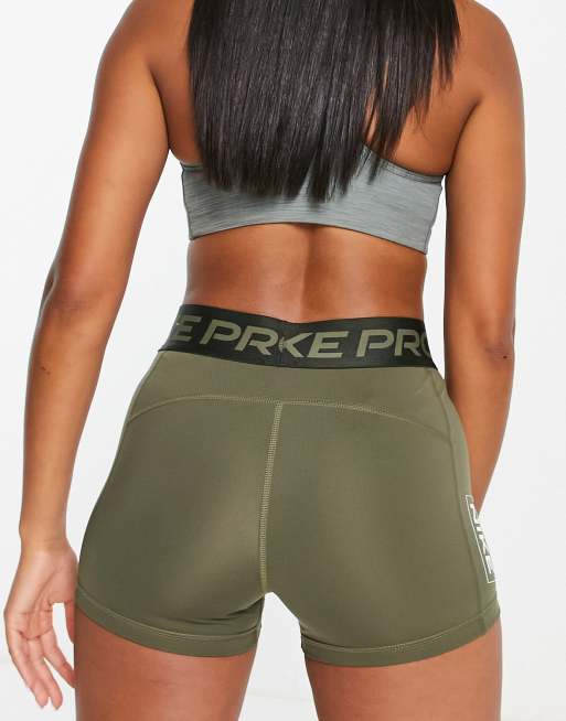 Under Armour Training mid rise booty shorts in orange