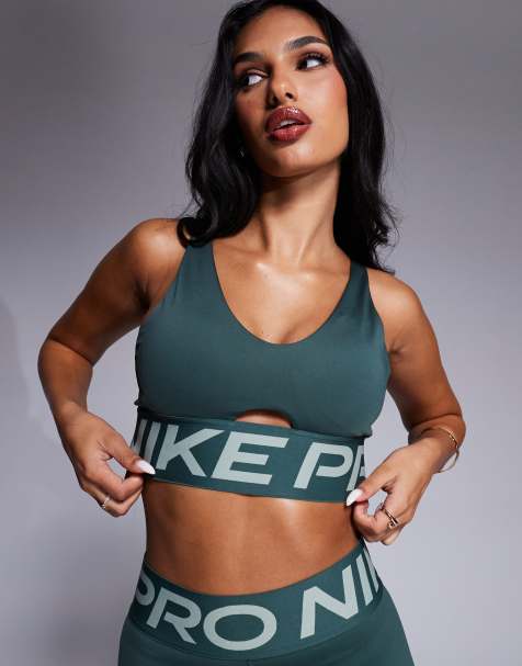 Nike Training – Pro – Sport-BH in Grün mit mittlerer Stützfunktion und tiefem Ausschnitt - view 1