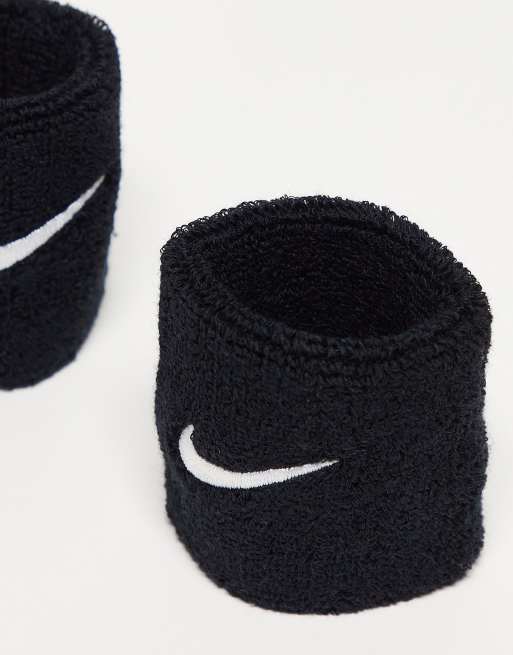 Nike Training Serre-poignets unisexes à logo virgule Noir ASOS