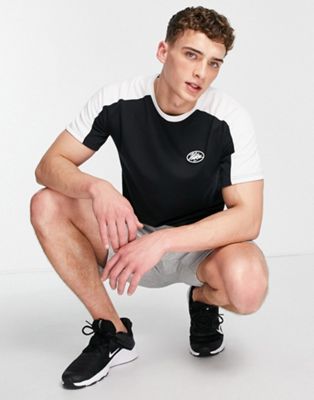 Nike Training Sport Clash cut and sew t-shirt in black and white