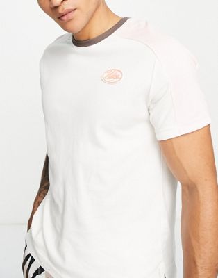 Nike Training Sport Clash cut and sew t-shirt in white and pink
