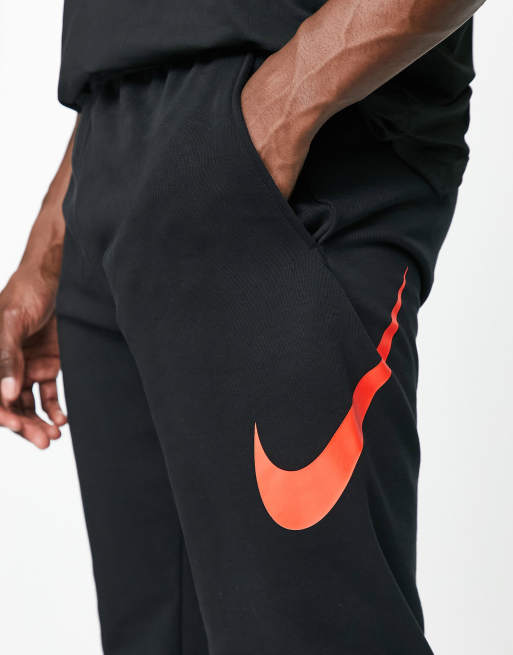 Nike Training Swoosh Dri FIT tapered joggers in black and red ASOS