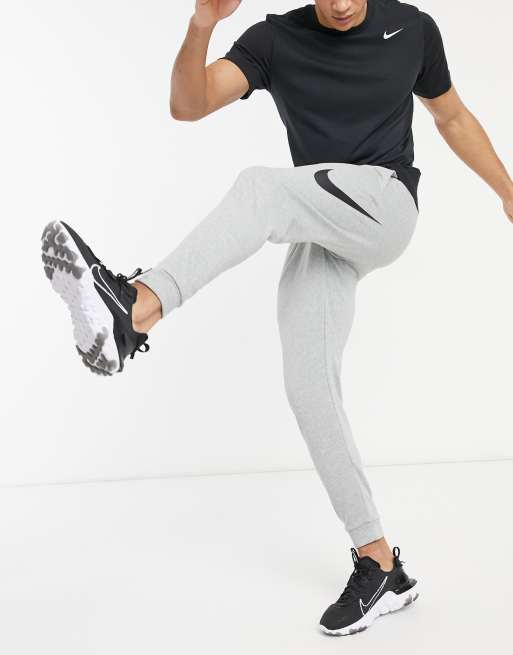 Nike Training Swoosh joggers in grey ASOS