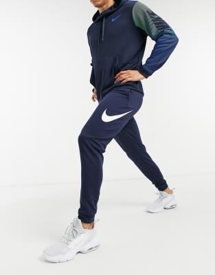 white nike shoes with navy swoosh