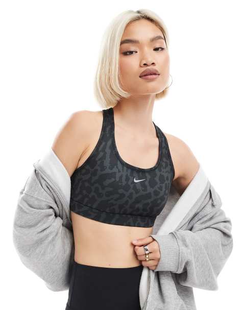 Nike Training Swoosh Leopard Print medium support sports bra in black - view 1