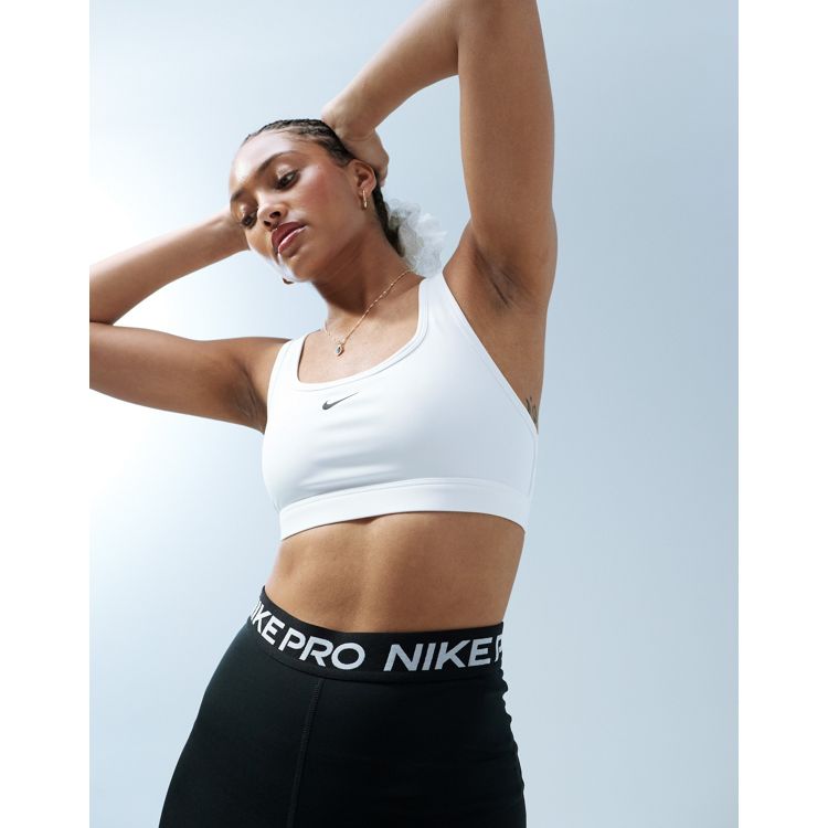 Nike Pro Training Swoosh asymmetric bra in black and yellow