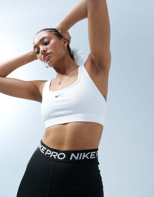 Nike Pro Training swoosh bra in white, ASOS