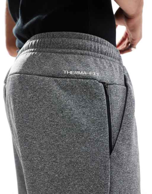 Nike Training – Swoosh – Schmal zulaufende Jogginghose in Grau mit