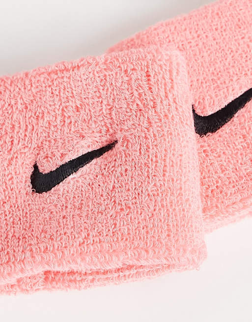 Nike Training Swoosh unisex wristbands in pink ASOS