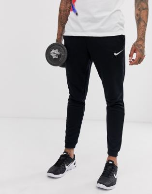 nike training tapered fleece pants in black