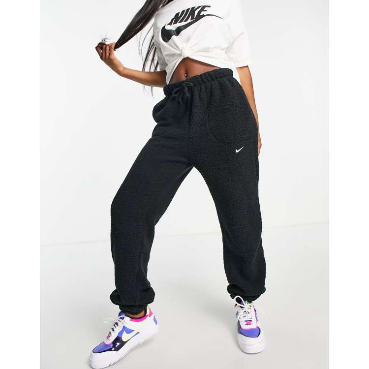 Asos black nike joggers sale