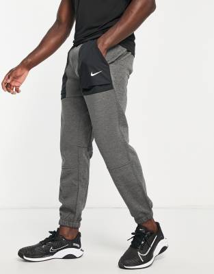 nike training therma tapered joggers in black