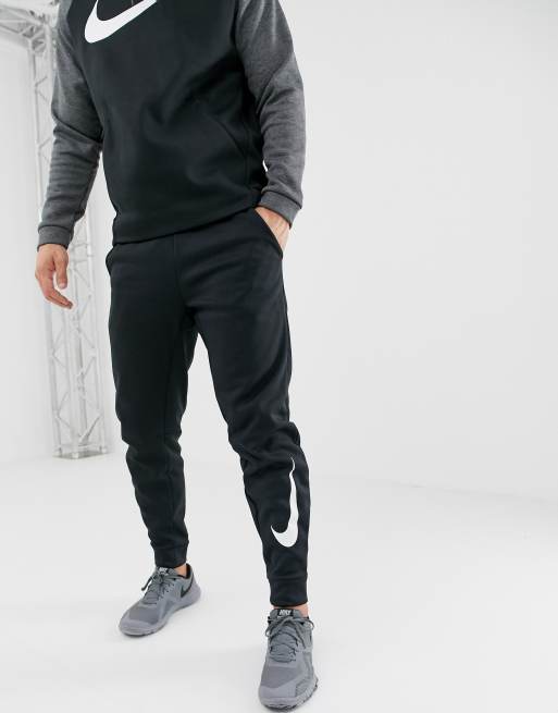 Nike Training therma sweatpants in black with placement swoosh print | ASOS