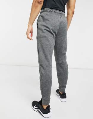 Nike tapered tracksuit best sale