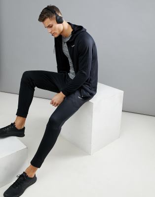 nike training therma tapered joggers in black