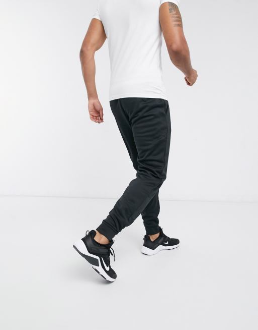 Nike training therma tapered joggers in black new arrivals