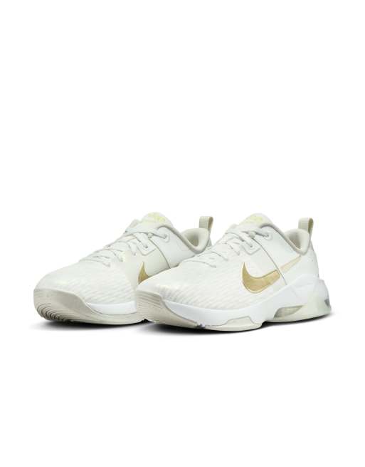 Nike Training Zoom Bella 6 premium trainers in white and gold