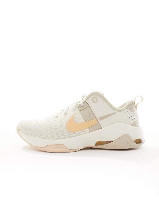 Nike Training Zoom Bella 6 trainers in white and peach ASOS