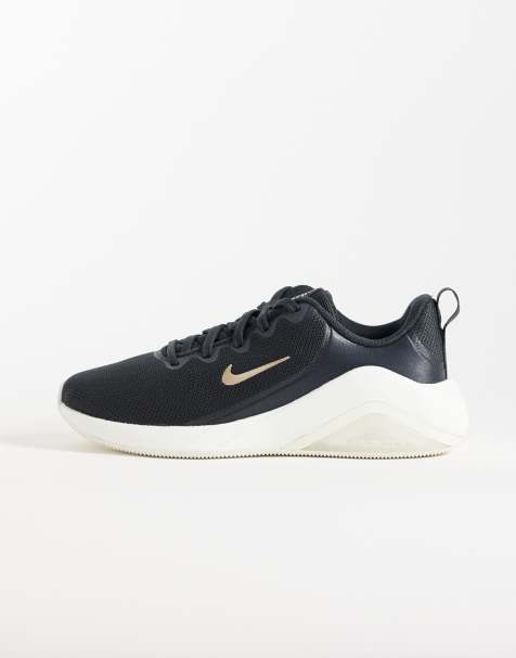 Nike Training Zoom Bella 7 trainers in black & gold - view 1
